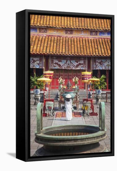 Woman Wearing Ao Dai Dress at Mieu Temple Inside Citadel, Hue, Thua Thien-Hue, Vietnam, Indochina-Ian Trower-Framed Stretched Canvas