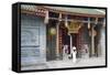 Woman Wearing Ao Dai Dress at Nghia an Hoi Quan Pagoda, Cholon, Ho Chi Minh City, Vietnam-Ian Trower-Framed Stretched Canvas