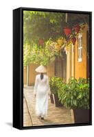 Woman Wearing Ao Dai Dress Walking Along Street, Hoi An, Quang Ham, Vietnam-Ian Trower-Framed Stretched Canvas