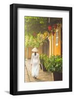 Woman Wearing Ao Dai Dress Walking Along Street, Hoi An, Quang Ham, Vietnam-Ian Trower-Framed Photographic Print