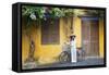 Woman Wearing Ao Dai Dress with Bicycle, Hoi An, Quang Ham, Vietnam-Ian Trower-Framed Stretched Canvas