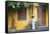 Woman Wearing Ao Dai Dress with Bicycle, Hoi An, Quang Ham, Vietnam-Ian Trower-Framed Stretched Canvas