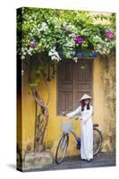 Woman Wearing Ao Dai Dress with Bicycle, Hoi An, Quang Ham, Vietnam-Ian Trower-Stretched Canvas