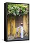 Woman Wearing Ao Dai Dress with Bicycle, Hoi An, Quang Ham, Vietnam-Ian Trower-Framed Stretched Canvas