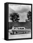 Woman with a 1957 Cadillac Coupe De Ville-null-Framed Stretched Canvas