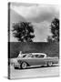 Woman with a 1957 Cadillac Coupe De Ville-null-Stretched Canvas