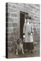 Woman with a Dog Outside a House-null-Stretched Canvas