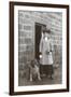 Woman with a Dog Outside a House-null-Framed Photographic Print