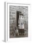 Woman with a Dog Outside a House-null-Framed Photographic Print