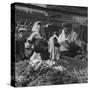 Woman with a Small Terrier Buying Bagels at a Market Stall, Possibly London, C.1945-50-null-Stretched Canvas