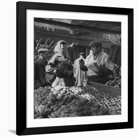 Woman with a Small Terrier Buying Bagels at a Market Stall, Possibly London, C.1945-50-null-Framed Giclee Print