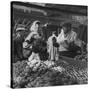 Woman with a Small Terrier Buying Bagels at a Market Stall, Possibly London, C.1945-50-null-Stretched Canvas