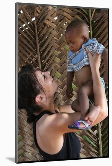 Woman with an African child, Lome, Togo-Godong-Mounted Photographic Print