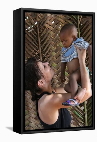 Woman with an African child, Lome, Togo-Godong-Framed Stretched Canvas