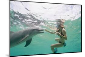 Woman with Bottlenose Dolphin-Stuart Westmorland-Mounted Photographic Print
