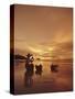 Woman with lamp and baskets on the beach, Phuket, Thailand-Luca Tettoni-Stretched Canvas