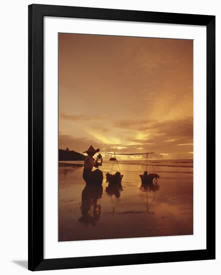 Woman with lamp and baskets on the beach, Phuket, Thailand-Luca Tettoni-Framed Photographic Print