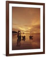 Woman with lamp and baskets on the beach, Phuket, Thailand-Luca Tettoni-Framed Photographic Print