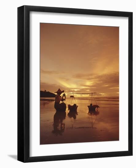 Woman with lamp and baskets on the beach, Phuket, Thailand-Luca Tettoni-Framed Photographic Print