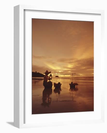 Woman with lamp and baskets on the beach, Phuket, Thailand-Luca Tettoni-Framed Photographic Print