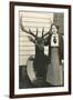 Woman with Mounted Deer Head-null-Framed Art Print