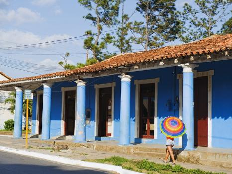 Woman With Parasol Walking Past a Colourful Building, Vinales Valley, Cuba,  West Indies, Caribbean' Photographic Print - Christian Kober |  AllPosters.com