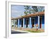 Woman With Parasol Walking Past a Colourful Building, Vinales Valley, Cuba, West Indies, Caribbean-Christian Kober-Framed Photographic Print