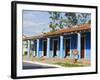 Woman With Parasol Walking Past a Colourful Building, Vinales Valley, Cuba, West Indies, Caribbean-Christian Kober-Framed Photographic Print