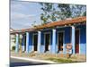 Woman With Parasol Walking Past a Colourful Building, Vinales Valley, Cuba, West Indies, Caribbean-Christian Kober-Mounted Photographic Print