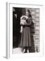 Woman with Pekingese Dog Outside a House-null-Framed Photographic Print