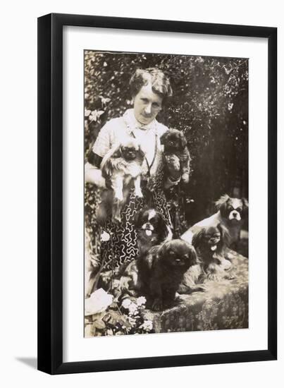 Woman with Pekingese Dogs and Puppies in a Garden-null-Framed Premium Photographic Print