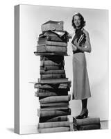 Woman With Pile Of Large Books-null-Stretched Canvas