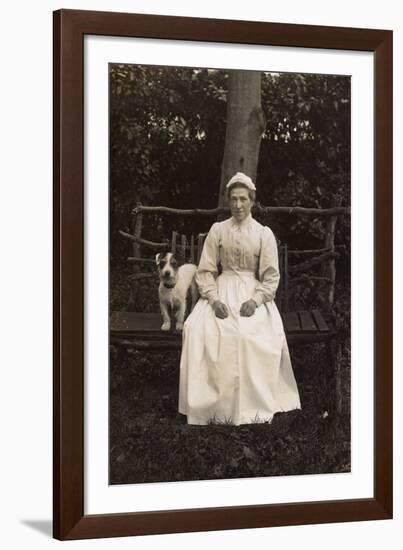 Woman with Terrier on a Bench in a Garden-null-Framed Photographic Print