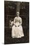 Woman with Terrier on a Bench in a Garden-null-Mounted Photographic Print