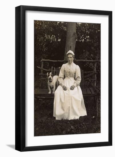Woman with Terrier on a Bench in a Garden-null-Framed Photographic Print