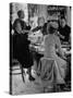 Women at a Powder Bar in Department Store Being Advised on Make Up by Operators-Leonard Mccombe-Stretched Canvas