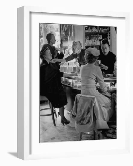 Women at a Powder Bar in Department Store Being Advised on Make Up by Operators-Leonard Mccombe-Framed Photographic Print