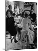 Women at a Powder Bar in Department Store Being Advised on Make Up by Operators-Leonard Mccombe-Mounted Photographic Print