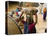 Women Construction Workers Prepare Concrete at a Site for a Multiplex Complex-null-Stretched Canvas
