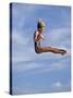 Women Diver Flying Through the Air, California, USA-Paul Sutton-Stretched Canvas