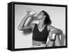 Women Drinking after Exercise Session in Fitness Studio, New York, New York, USA-Paul Sutton-Framed Stretched Canvas