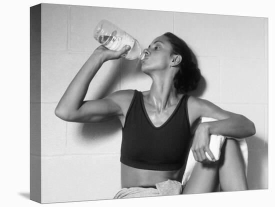 Women Drinking after Exercise Session in Fitness Studio, New York, New York, USA-Paul Sutton-Stretched Canvas