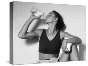 Women Drinking after Exercise Session in Fitness Studio, New York, New York, USA-Paul Sutton-Stretched Canvas