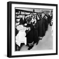 Women Eagerly Shop across the Counter at a Newly Opened Sears Retail Store-null-Framed Photo