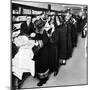 Women Eagerly Shop across the Counter at a Newly Opened Sears Retail Store-null-Mounted Photo
