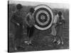 Women examining Archery Target Photograph - Washington, DC-Lantern Press-Stretched Canvas