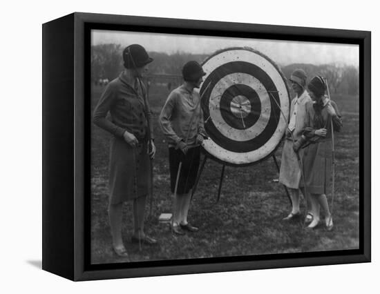 Women examining Archery Target Photograph - Washington, DC-Lantern Press-Framed Stretched Canvas