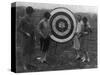 Women examining Archery Target Photograph - Washington, DC-Lantern Press-Stretched Canvas