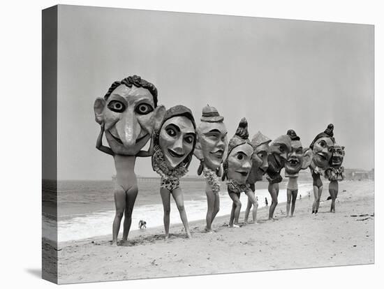 Women Holding Giant Masks-Bettmann-Stretched Canvas