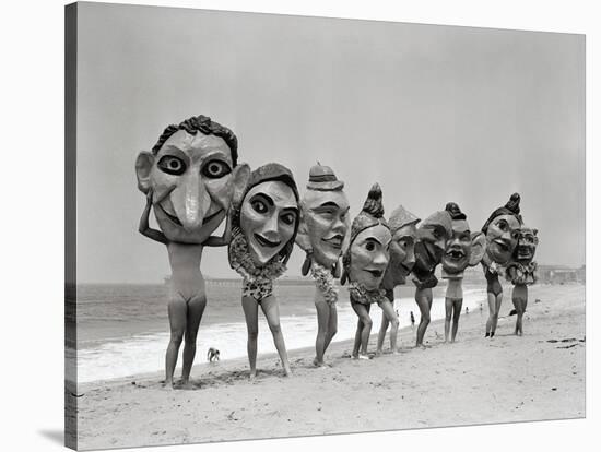 Women Holding Giant Masks-Bettmann-Stretched Canvas